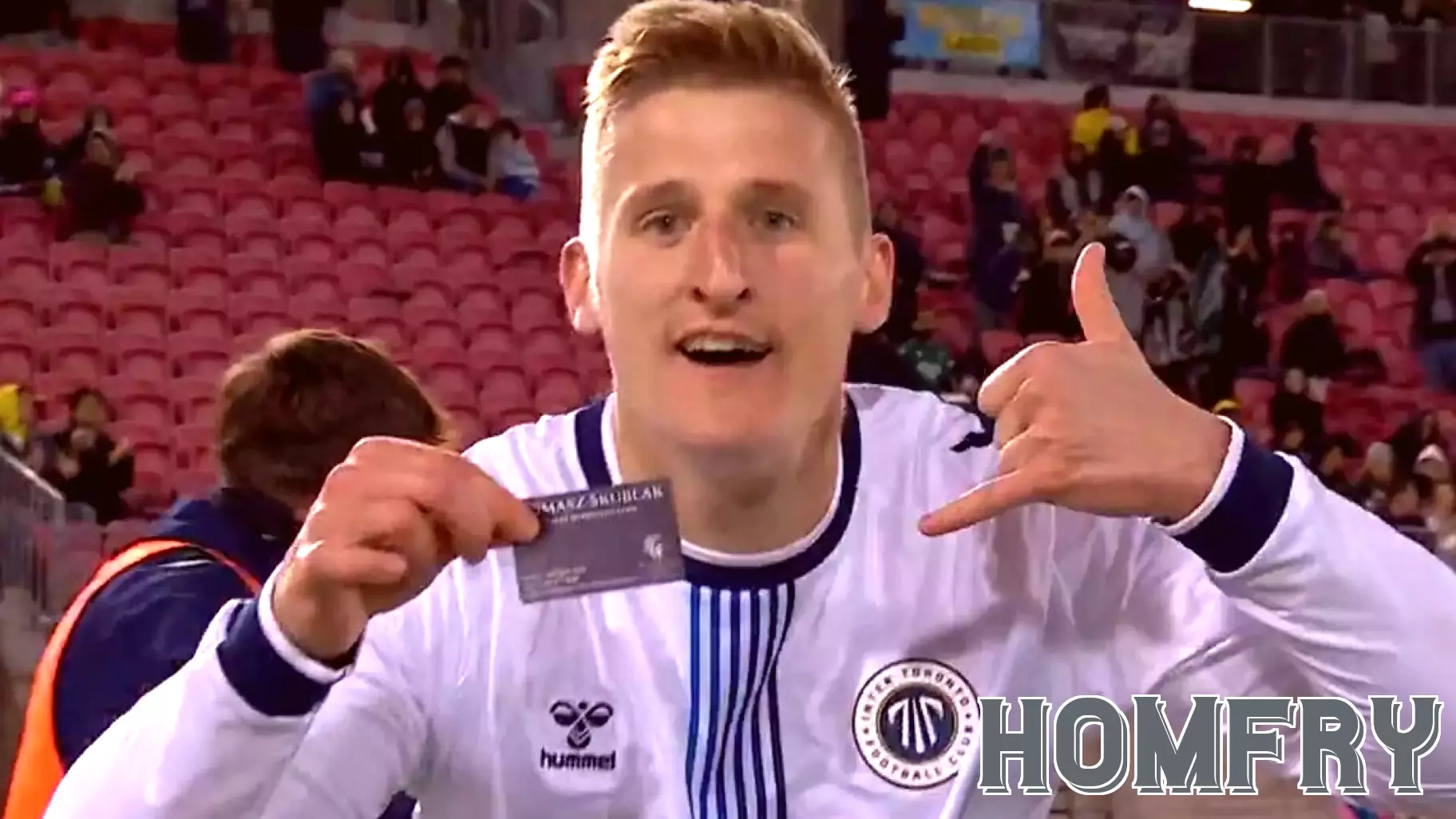 Canadian forward/real estate agent flashes business card in goal celebration